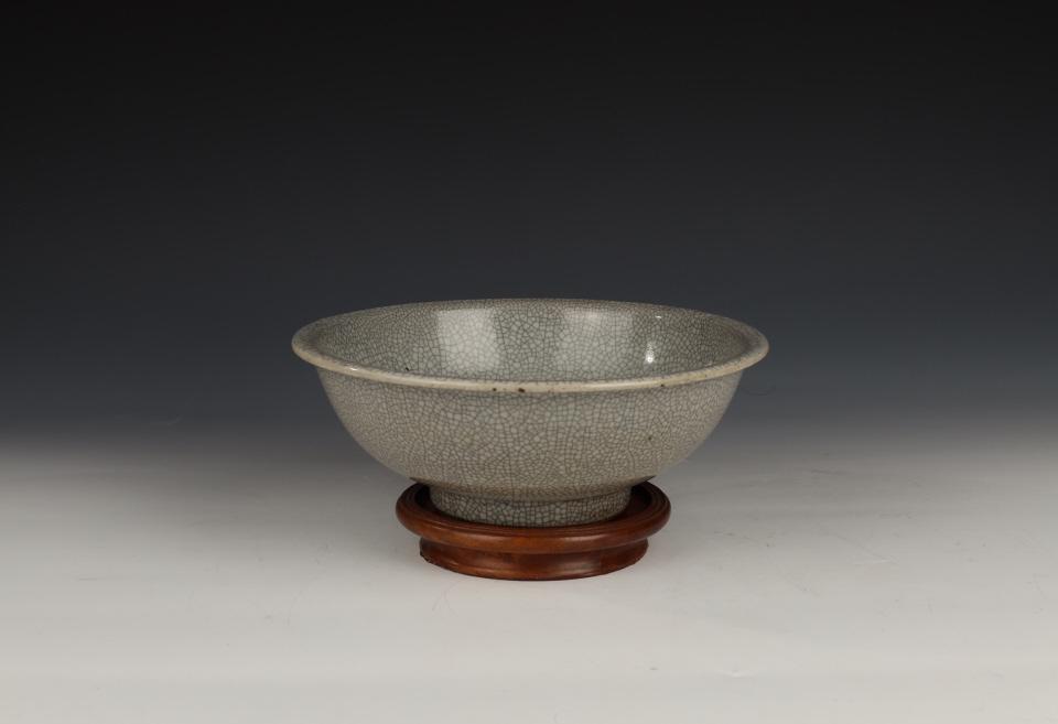 Guan-type Crackle Bowl, Qing Dynasty: China, Qing Dynasty, Jiaqing period Dimensions: 10.7" (27.3cm) Dia. Porcelain serving bowl with greyish cream underglaze and imitation guan ware crackle pattern. Includes certificate of antique issued