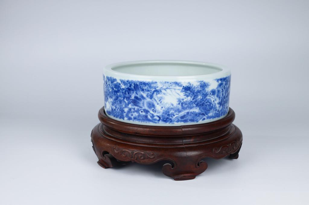 Signed Wang Bu - Blue White Brush Washer with Stand: China, 20th century Dimensions: 8.5" (21.6cm) Dia Blue-and-white brushwater decorated with flowers and birds. Six-character yuanwenwuzhiguozhai mark in underglaze blue. PLEASE NOTE THIS LOT IS TO BE O