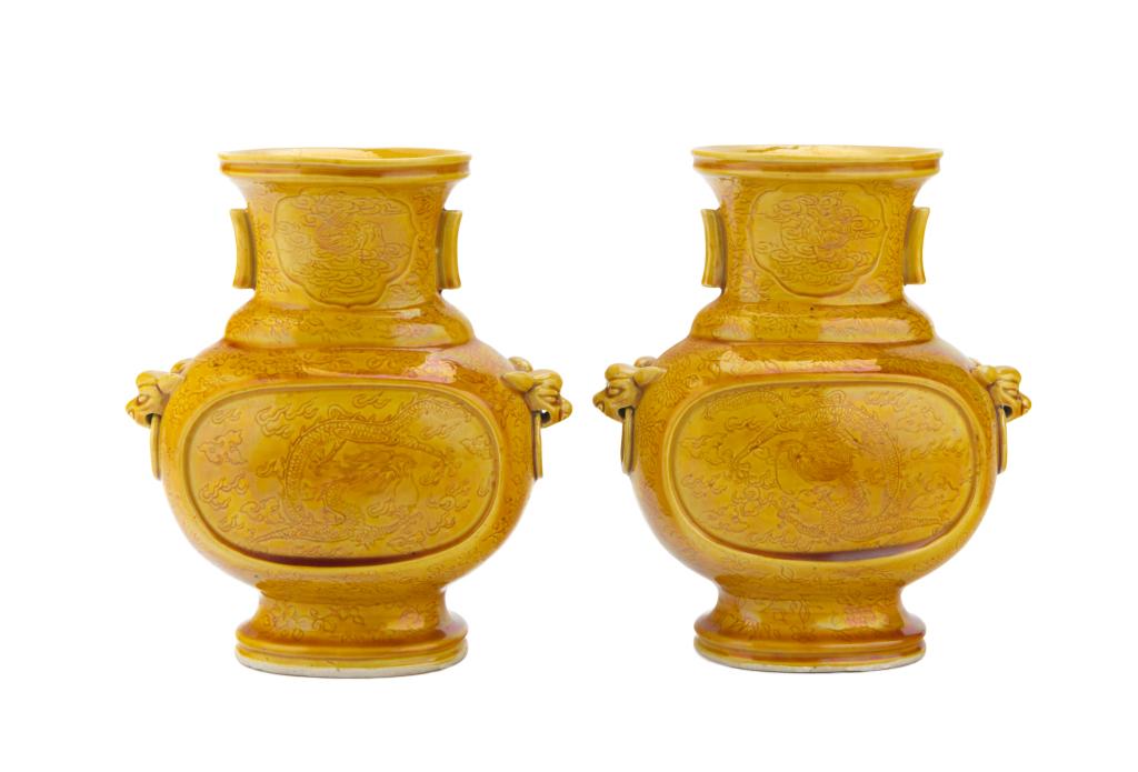 Pair of Yellow Glazed Incised Dragon Zun-Shaped Vases, Qianlong Mark, Qing Dynasty: China, Qing dynasty Dimensions: 6 3/4" (17.1cm) H (2) Pair of yellow glaze zun-shaped vases decorated with incised dragon patterns, the neck attached with a pair of tubular handles, the body flanked b