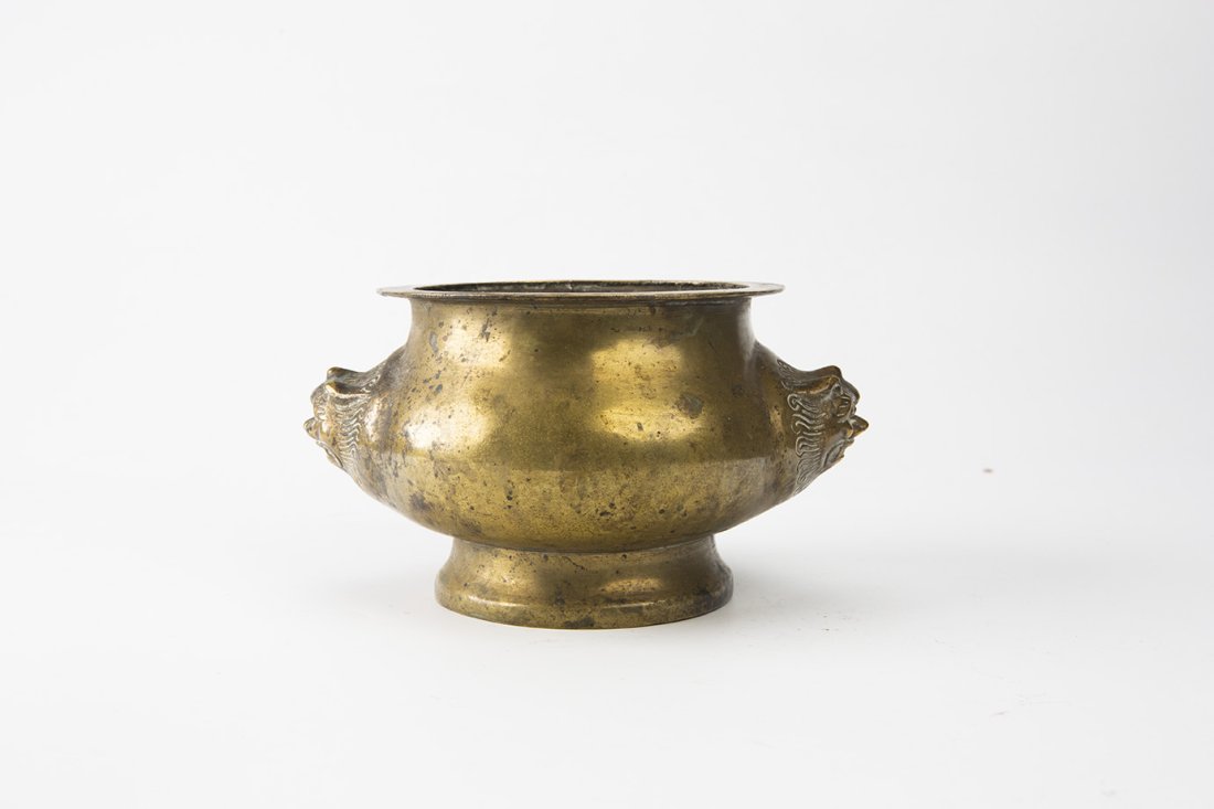 Bronze Temple Censer with Taotie Masks, 19th Century: China, Qing dynasty, 19th century Dimensions: 4 1/4" (10.8cm) H Decorated with two taotie-shaped handles to the sides. 19世纪 饕餮纹铜香炉 PLEASE NOTE T