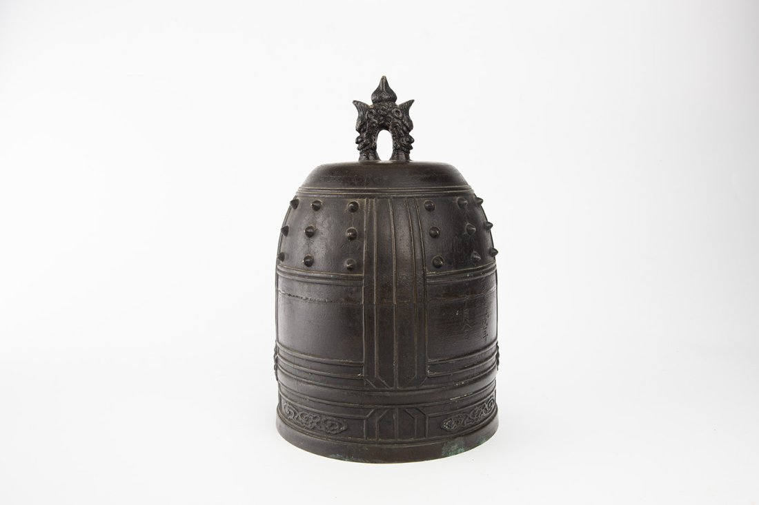 Bronze Temple Bell, 1539: Japan, Dated to Tembun 7th year (1539) Dimensions: 12 1/4" (31.1cm) H The upper part of the bronze bell decorated with well distributed spikes, the lower part decorated with sunflowers and auspicious 