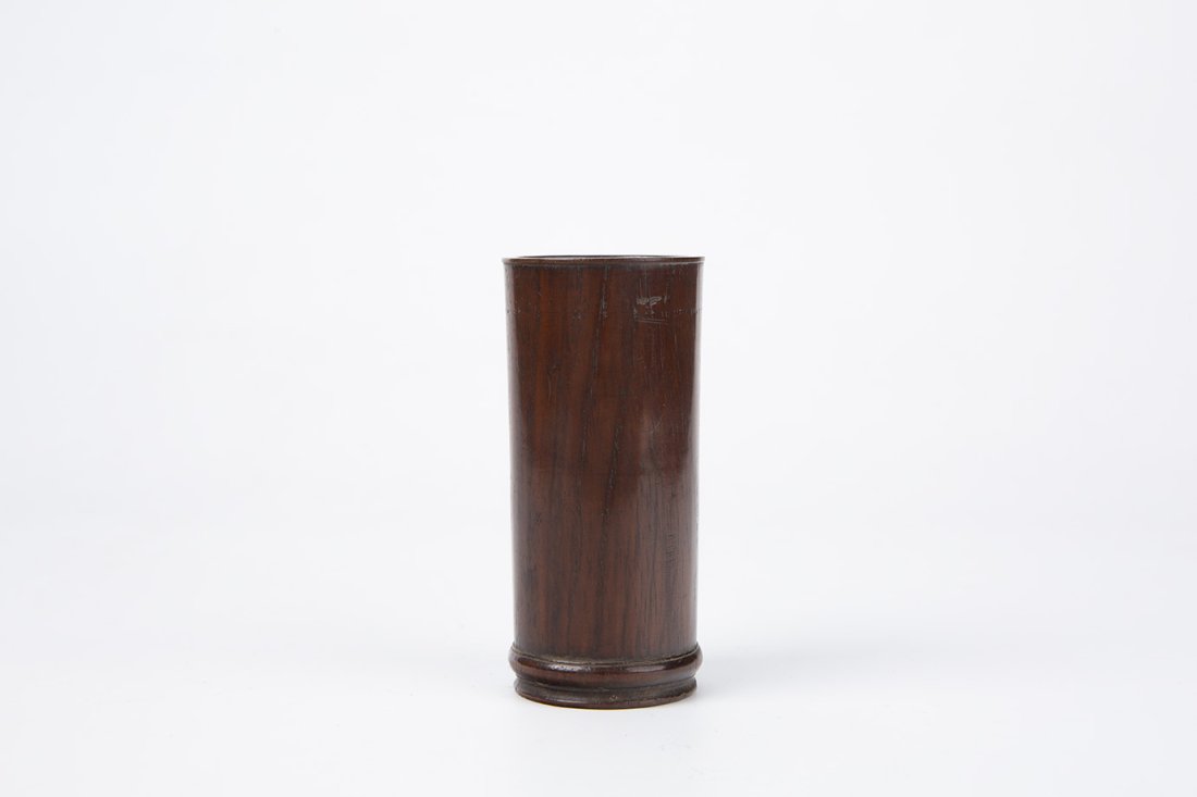 Huanghuali Brush Pot-Bitong,19th Century: China, Qing dynasty,19th century Dimensions: 4 1/8" (10.5cm) H, 1 7/8" (4.8cm) Dia Of slightly flared, rounded form, raised on a short ring foot. 19世纪 黄花梨笔
