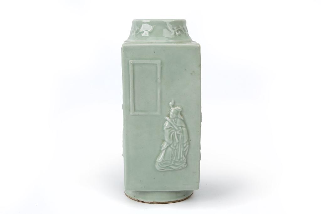 Celadon Glazed Cong-Shaped Vase: Dimensions: 10 1/4" (26cm) H Cong-shaped vase covered in a pale celadon glaze, decorated with figures on all four sides and floral designs on the neck, with a CHINA mark on the base next to a hole. &#