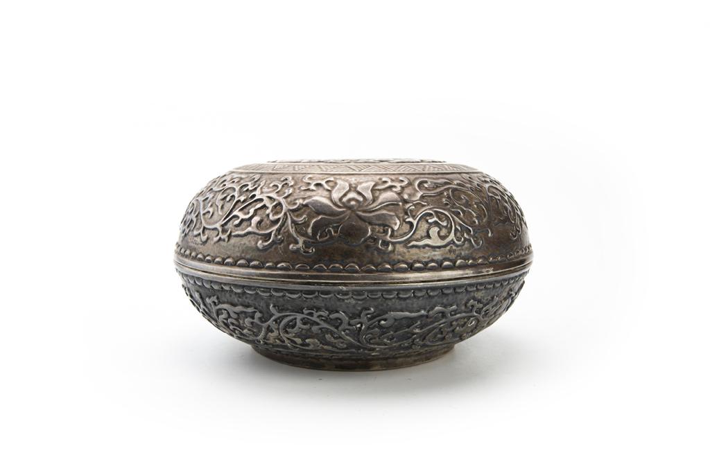 Rare Enameled Faux-Silver Round Box and Cover, Republican Period, Early 20th Century: China, Republican period, early 20th century Dimensions: 10" (25.4cm) Dia, 5 3/8" (13.7cm) H Enameled faux-silver round box and cover decorated with patterns of waves and scrolling leaves. 民