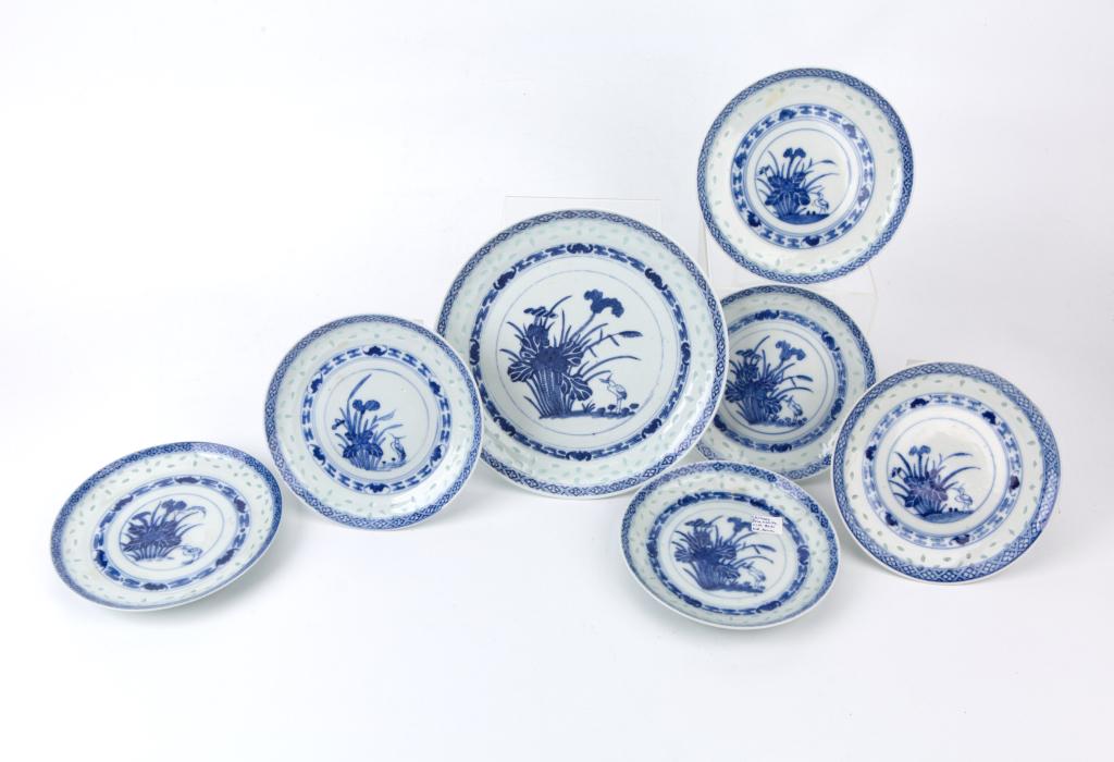Set of 7 Blue White Floral Dishes: China, 20th century Dimensions: 1: 8 1/2" (21.6cm) Dia; 2~7: 6 1/8" (15.6cm) Dia Comprising 1 blue-and-white dish decorated with flowers and bird, together with 6 smaller dishes of the same patterns. 