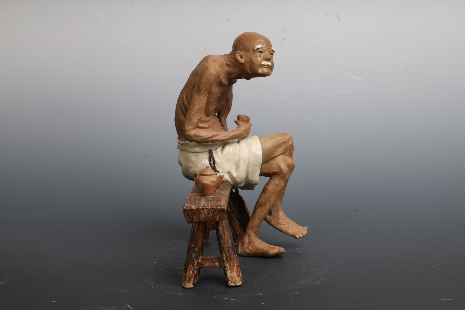 Shiwan Clay Tea tasting Feng Zuhui Master Nonshen year: 石湾窑 《品茶》冯祖辉 大师 壬申年制 Dimensions: 9" (22.86cm) H, 8 1/2" (22cm) L