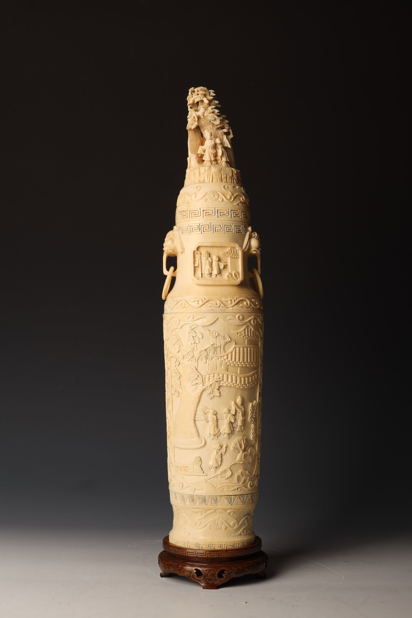 Bone Carved Figural Bottle Vase and Cover: ChinaDimensions: 20" (51cm) H ,with baseBone carved bottle vase depicting narrative scenes on the body, two-character Qianlong seal mark at the base; together with a lid with dedcorations of figures a