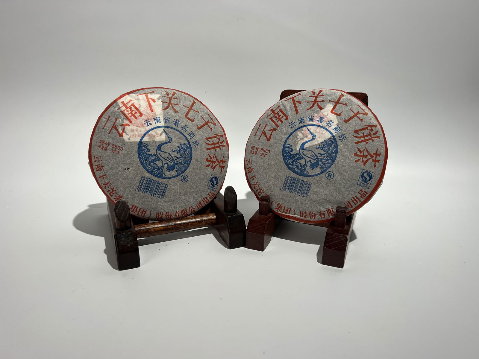 Two raw Pu-erh tea cakes of Xiaguan Qizi tea, 2006 (1 of 9)