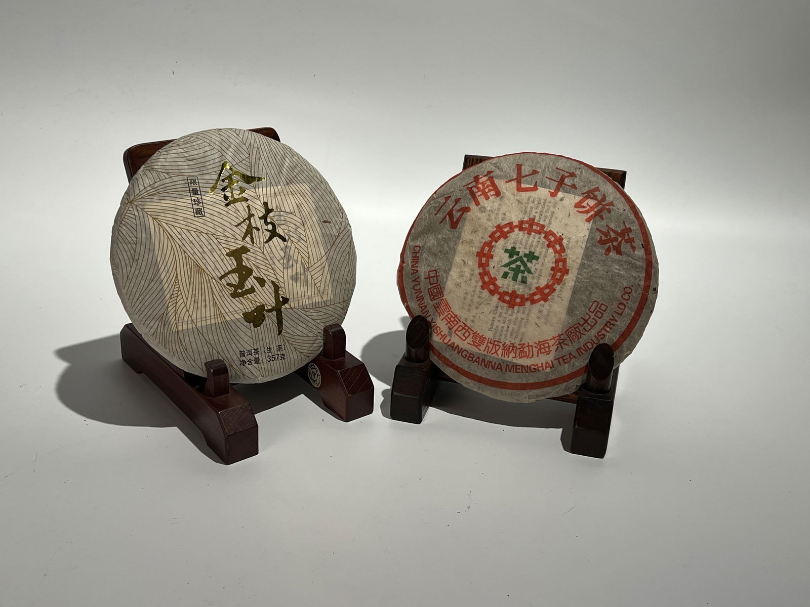 One Raw Pu-erh Tea Cake of Yunnan Qizi Tea from Xishuangbanna Menghai, 2002; One Raw Tea Cake of Jin (1 of 4)