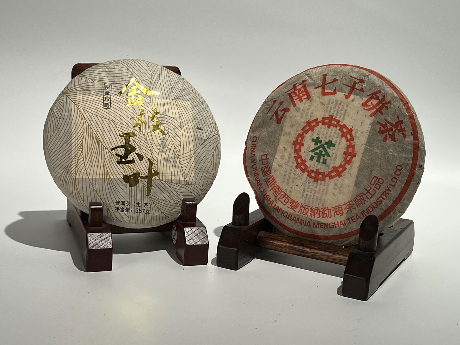 One Raw Pu-erh Tea Cake of Yunnan Qizi Tea from Xishuangbanna Menghai, 2002; One Raw Tea Cake of Jin (1 of 4)