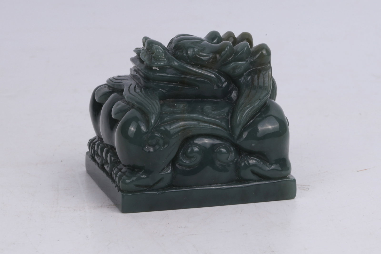 Carved Jade Seal with Dragon Knob China 20th Century: Carved Jade Seal with Dragon Knob China 20th Century Dimensions: 6.5cm W, 5.5cm H 20世纪中国雕龙钮玉印章一件