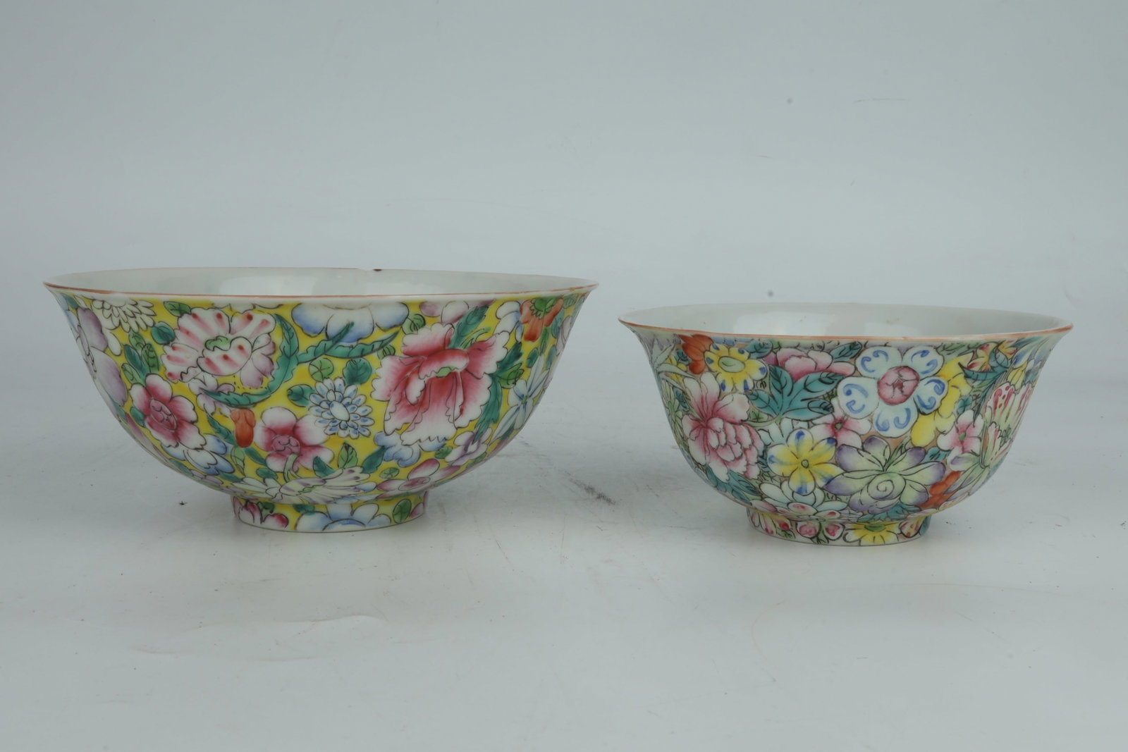 A Pair of 'Bai Hua Bu Luo Di' Porcelain Bowls China 20th Century: A Pair of 'Bai Hua Bu Luo Di' Porcelain Bowls China 20th Century Dimensions: large 16.5cm Dia, small 13cm Dia
