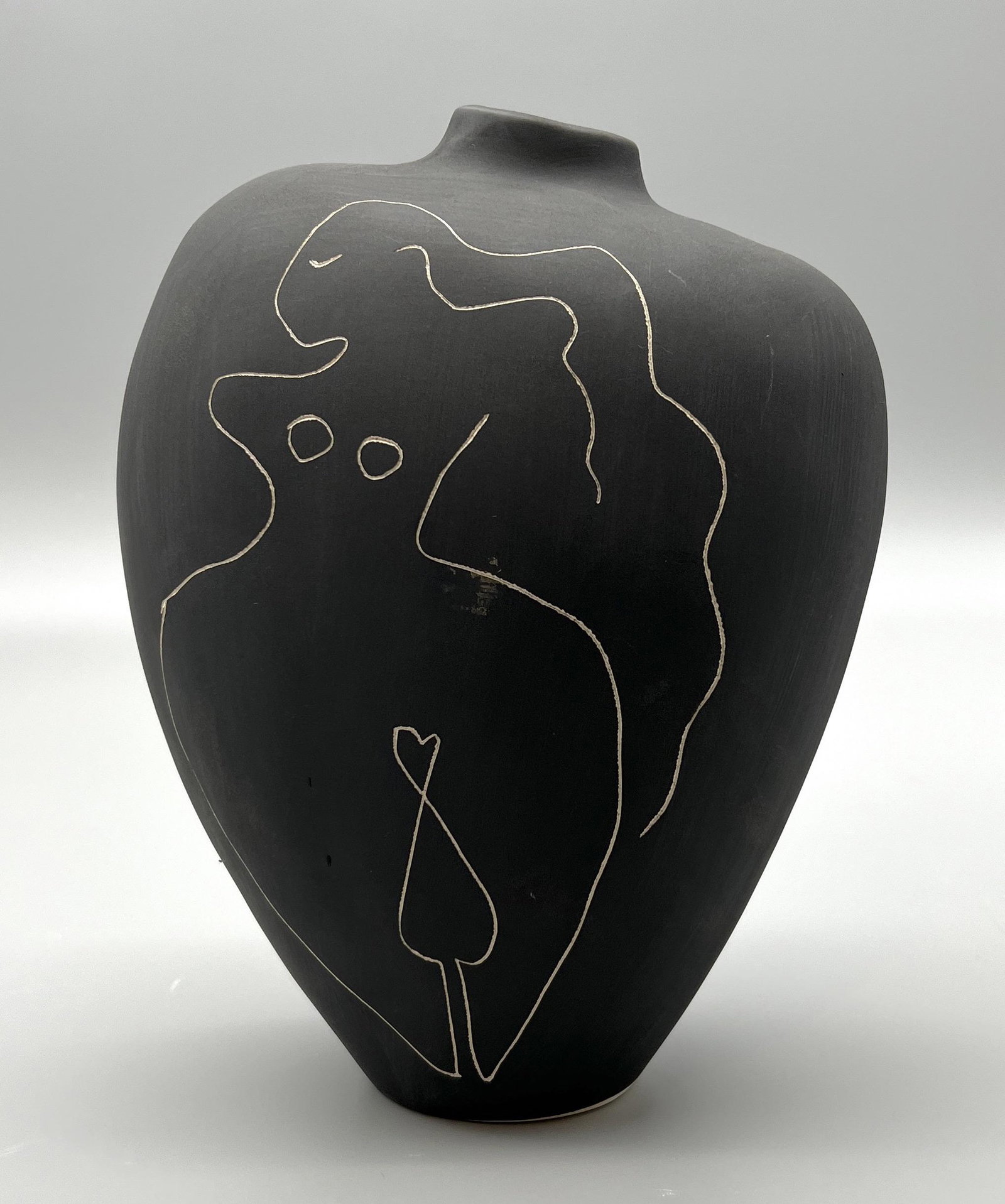 Modernist Abstract Ceramic Vase with Nude Female Figure: Modernist Abstract Ceramic Vase, matte-black chalk finish with an etched cut-out nude female figure on the front, in the style of Henri Matisse, 8" L x 5" W x 10" H
