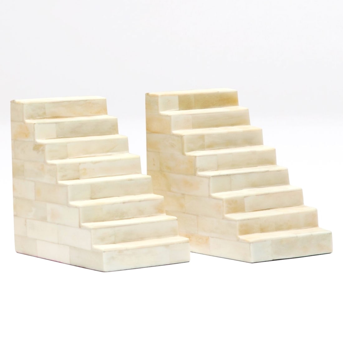 Tessellated Bone Bookends: Tessellated Bone Bookends A handcrafted set of bookends, in the Manner of Karl Springer, with natural bone tiles. Dimensions: height 6 in., width 6 in., depth 4 in., each Condi