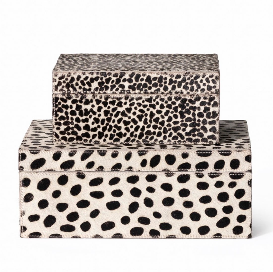 Set of Two Safari Leather Boxes: Set of Two Safari Leather Boxes A contemporary set of decorative boxes, clad in a dyed natural cowhide, handstitched. Dimensions: height 5 in., width 12 in., depth 10 in., large; height 4 in