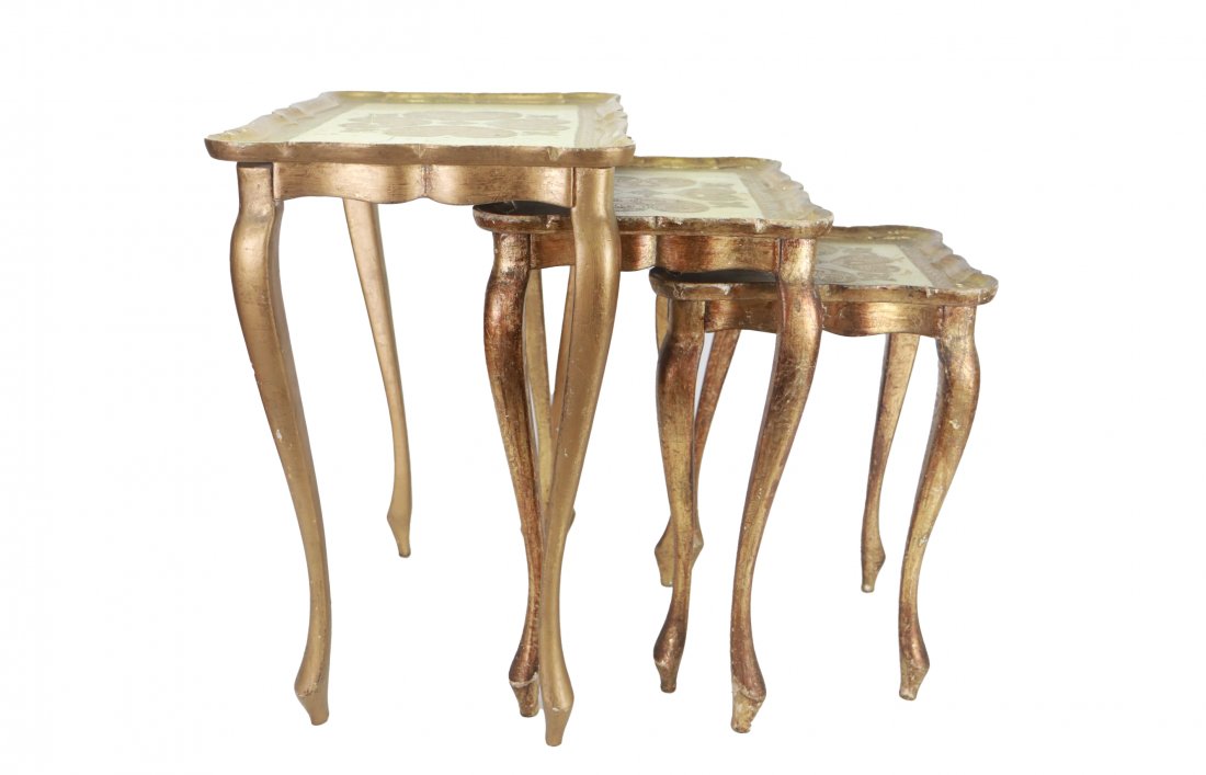 Set of Three Wooden Gilded Side Tables: Gorgeous set of tables with intricate gilded top design. Some damages commensurate with age. Please see photos for reference. Small Table: 12” x 17” x 12” Medium Table: 17” x 2