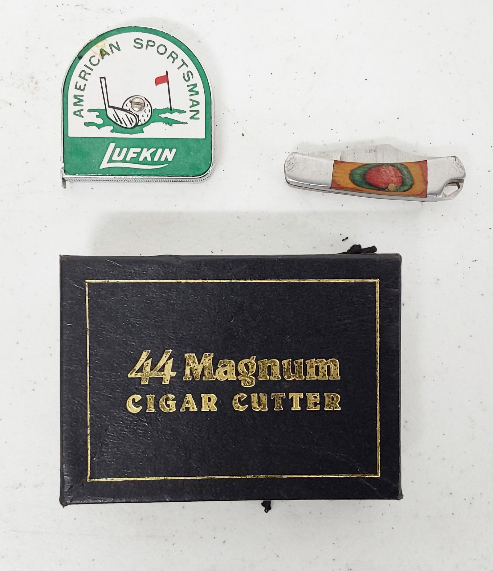 Cigar cutter, Lufkin tape and small knife: 44 Magnum cigar cutter, Lufkin tape and small knife