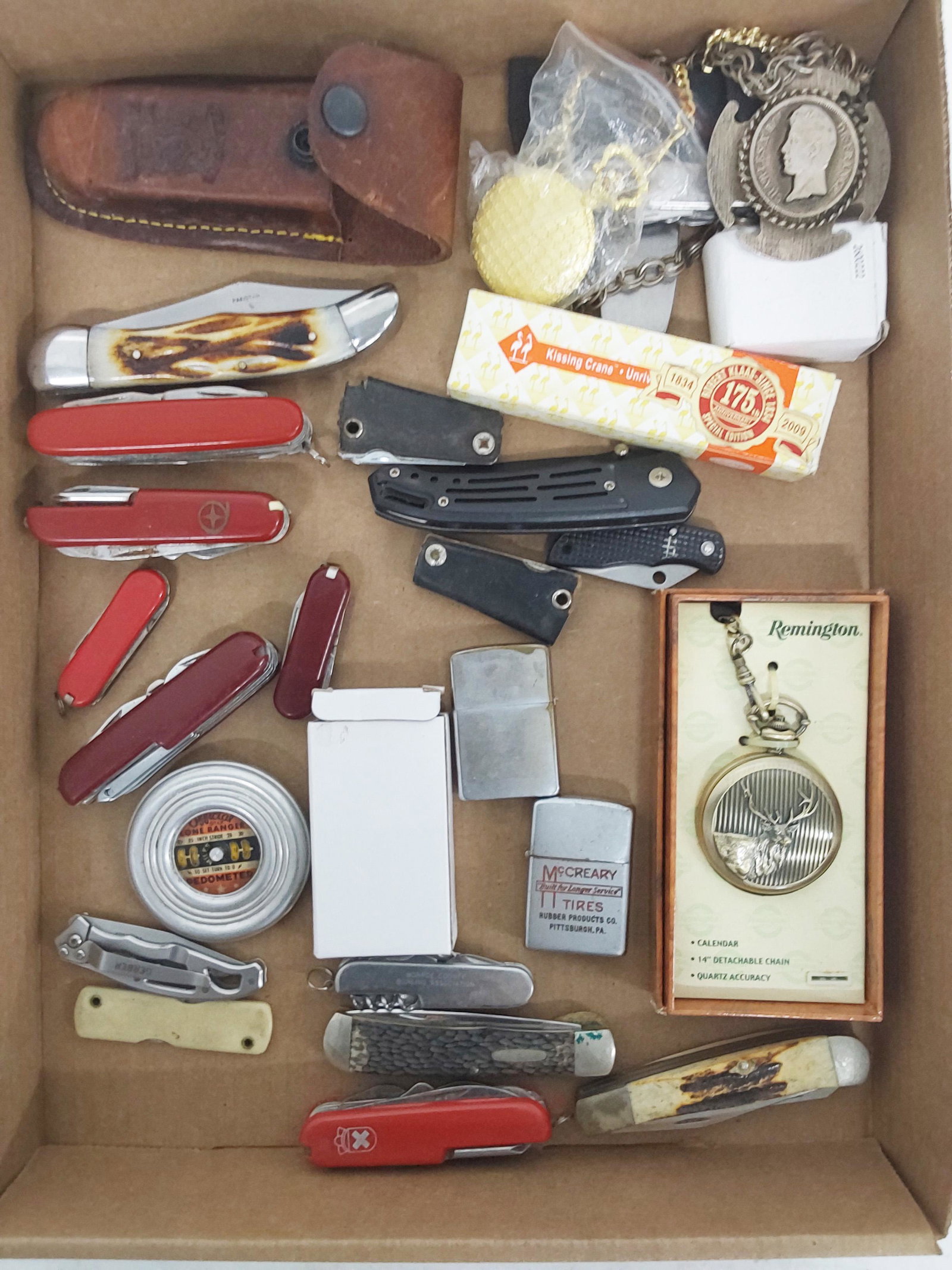 lot of pocketknives, McCreary tires and Zippo (1 of 2)