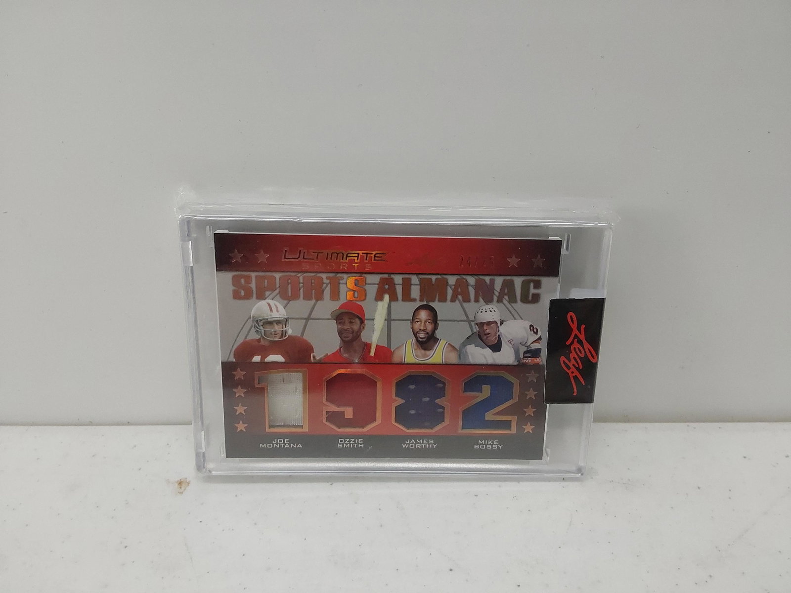 2021 Leaf Sports Almanac Jersey Card: Joe Montana, Ozzie Smith, James Worthy, Mike Bossy - 1982 /25