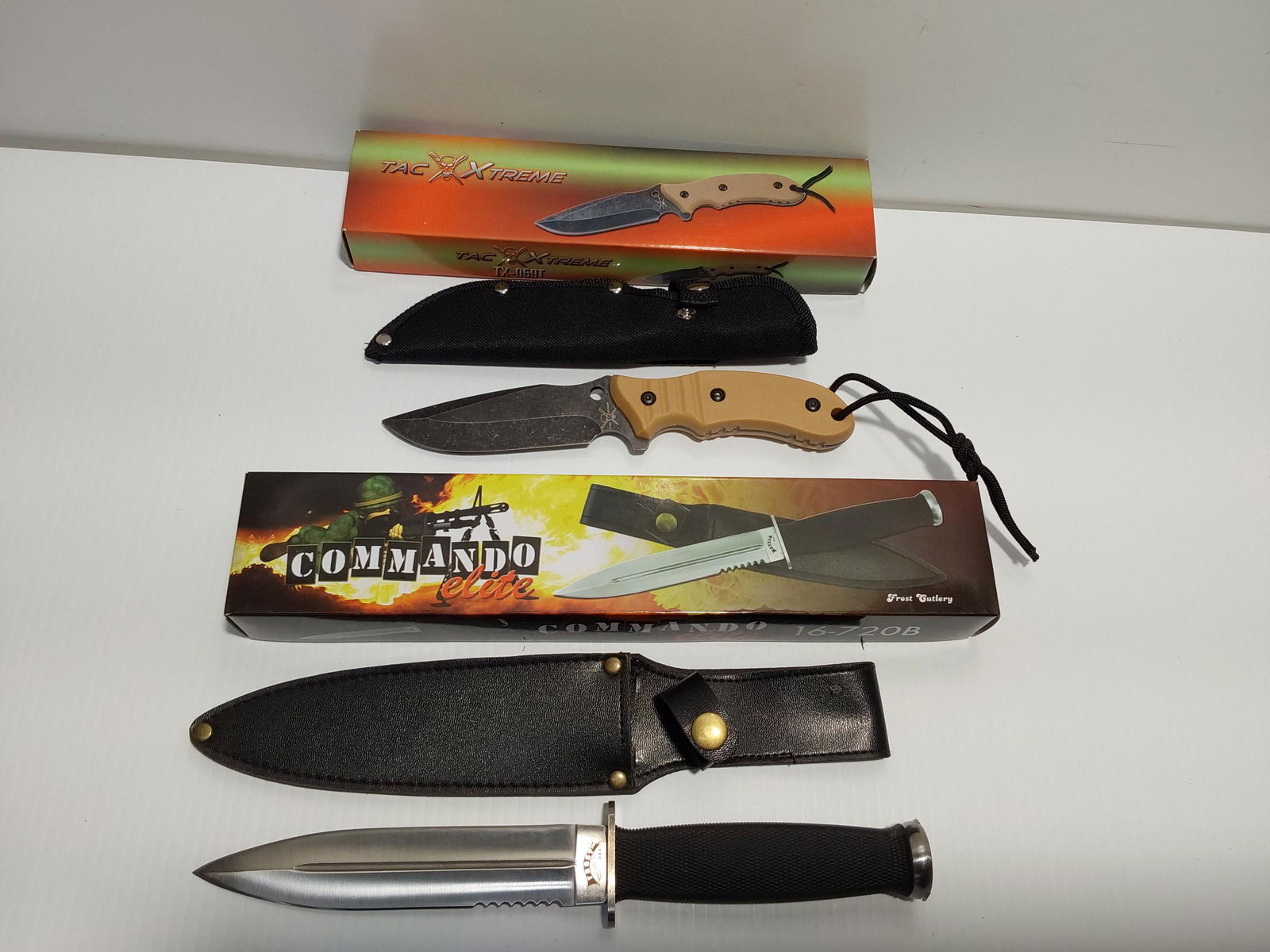 NEW Frost Cutlery & Tac Xtreme knives: Frost Cutlery Commando Elite: 6" fixed blade dagger knife (11 1/2" overall), rubber handle, with sheath. NEW. Tac Xtreme: 4 1/2" fixed blade (9" overall), with lanyard, nylon handle, includes sheath.