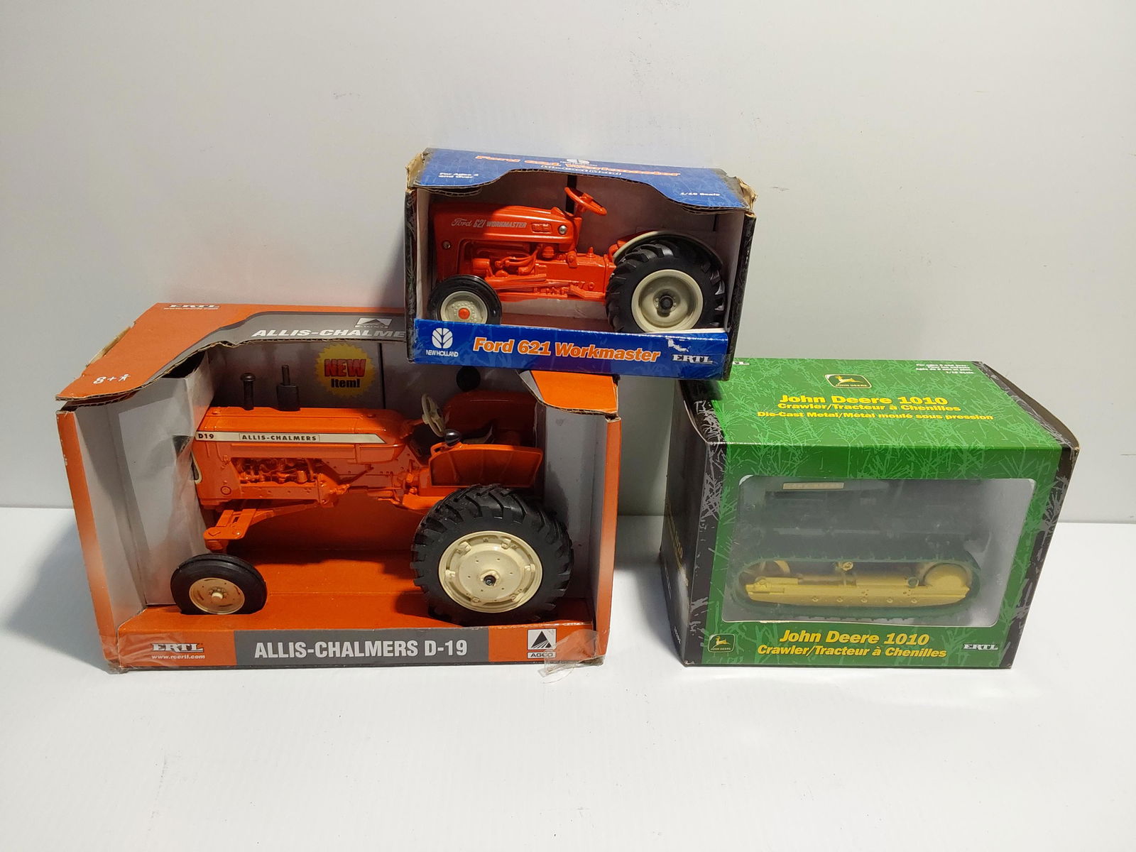 (3) tractor/equipment models in boxes: Allis-Chalmers D-19 tractor John Deere 1010 crawler Ford 621 tractor
