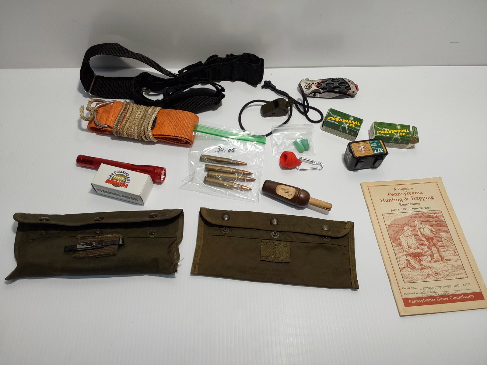 22 ammo and hunting lot: 2) partial boxes of 22 ammunition, deer drag, pellets, crow call, knife and more...
