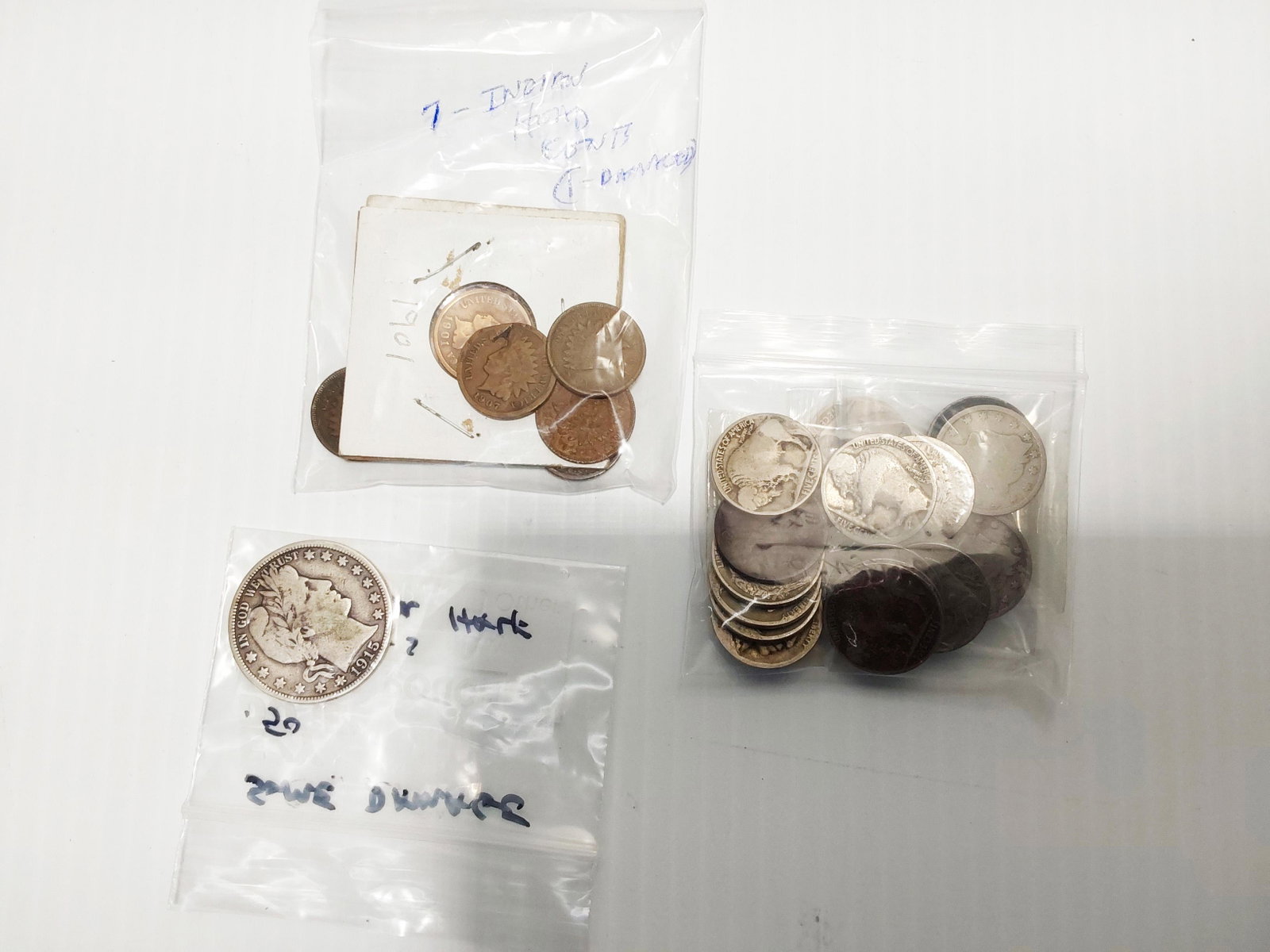 miscellaneous coin lot: (17) Buffalo nickles, (7) Indian head cents, 1915-S Barber half dollar