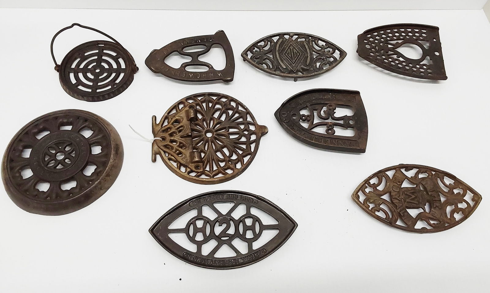 (9) miscellaneous trivets: (9) miscellaneous trivets