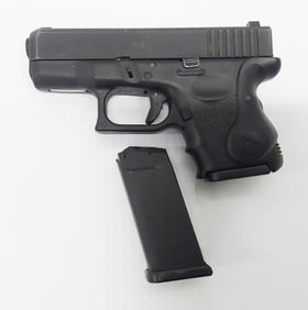 Glock model 26 9mm with Crimson trace, extra clip