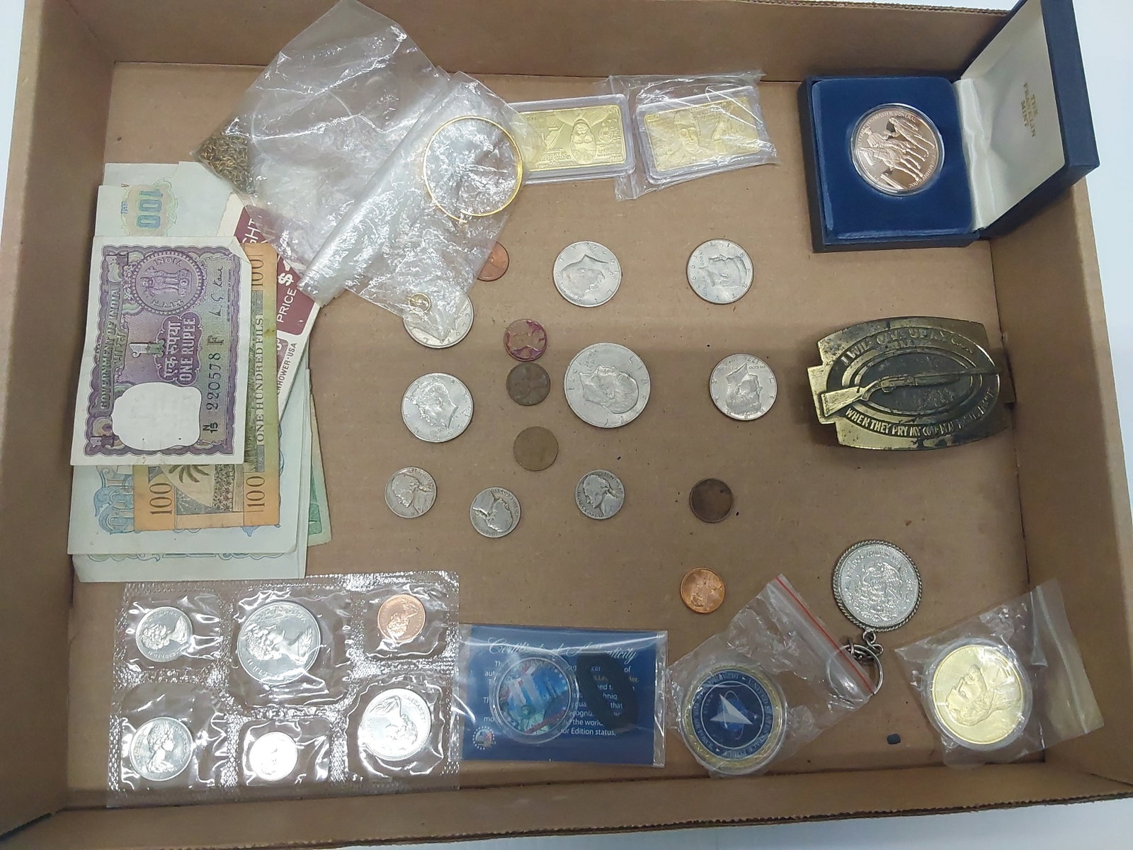 flat of foreign and US coins: belt buckle and miscellaneos