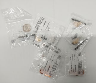 bag of various uncirculated coins