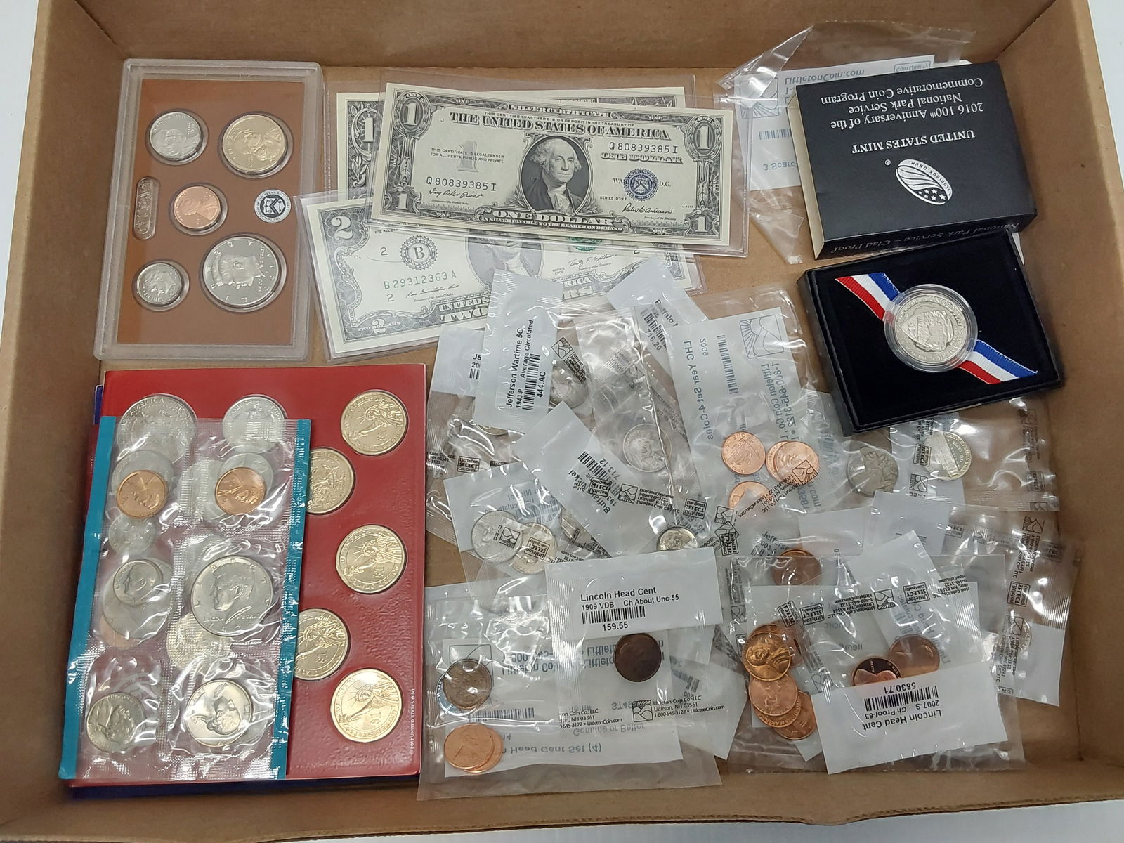 flat of miscellaneous coins and currency: (1) silver certiicate, some wheat cents, buffalo nickels, miscellaneous dollars