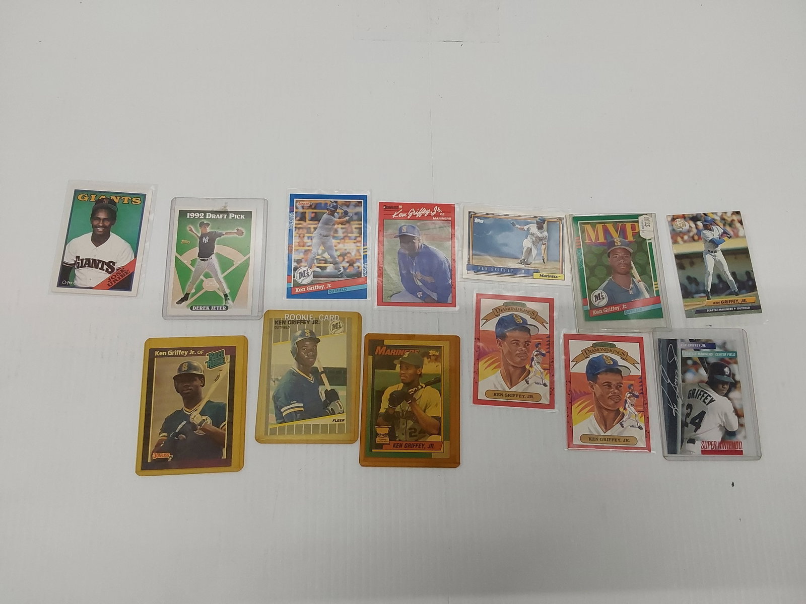(11) Ken Griffey Jr.: plus (2) additional cards: Jose Uribe and Derek Jeter