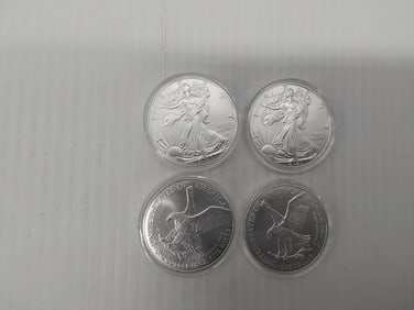 (4) silver Eagles in plastic