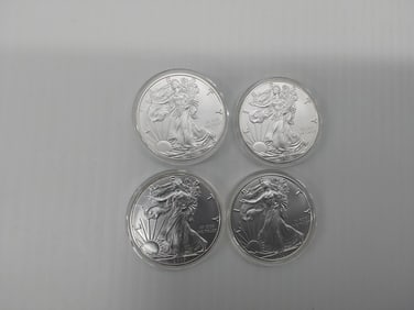 (4) silver Eagles in plastic