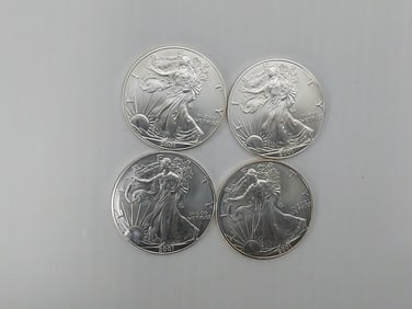 (4) 2001 silver Eagles