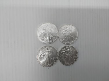 (4) 2004 silver Eagles