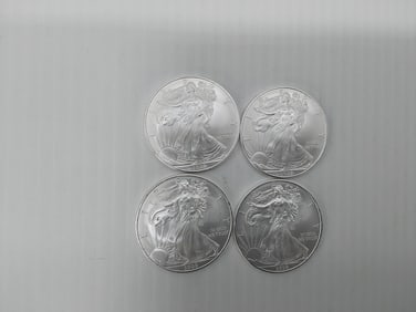 (4) 2009 silver Eagles