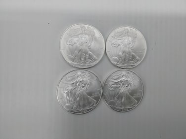 (4) 2009 silver Eagles