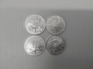 (4) 2009 silver Eagles