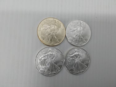 (4) 2009 silver Eagles