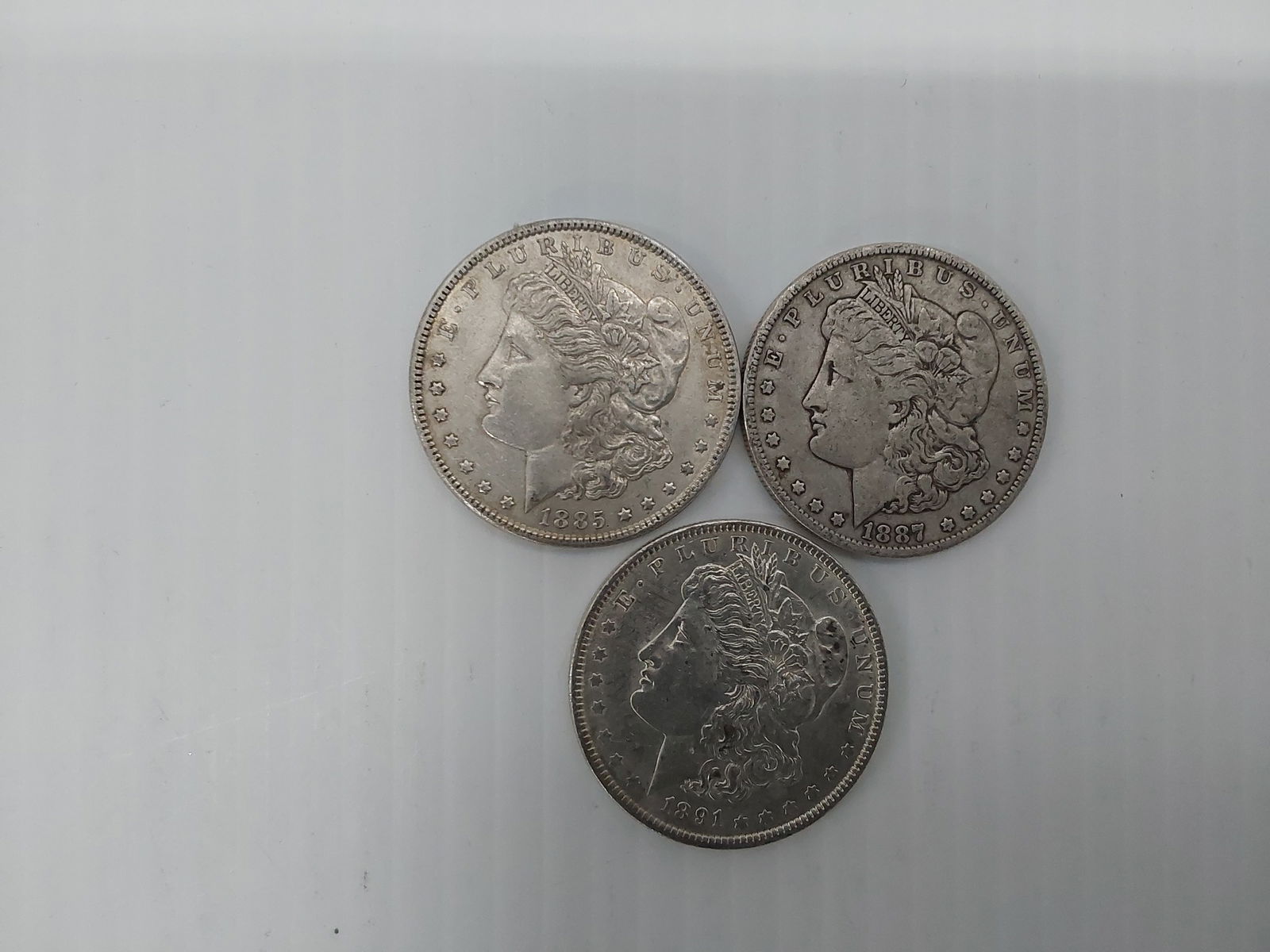 (3) Morgan silver dollars (1 of 2)