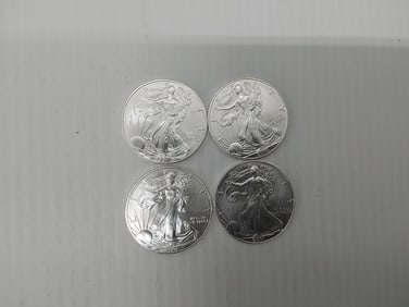 (4) 2001 silver Eagles