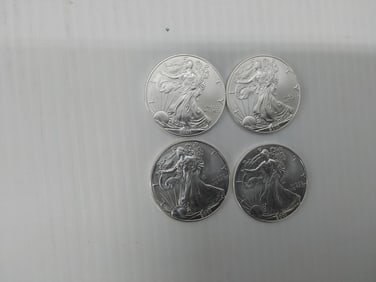 (4) 2001 silver Eagles