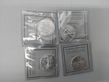 (4) 2015 silver Eagles in plastic