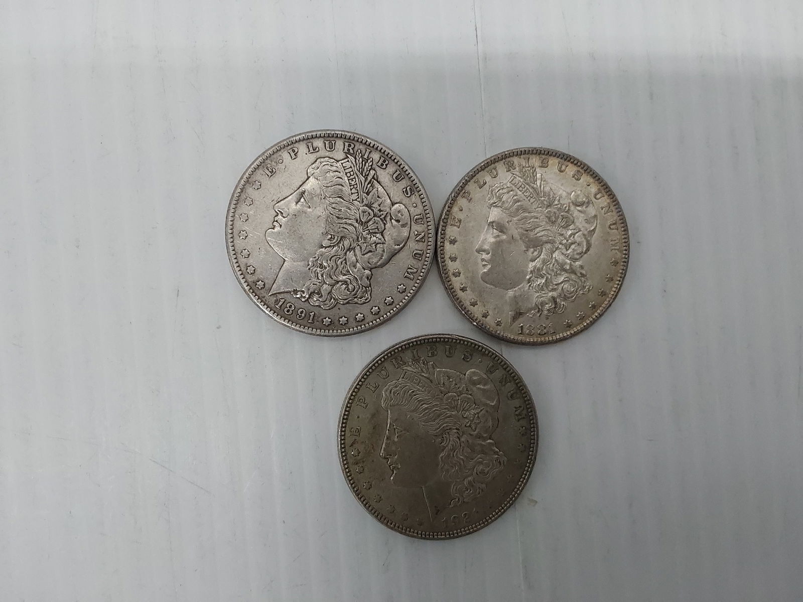 (3) Morgan silver dollars (1 of 2)