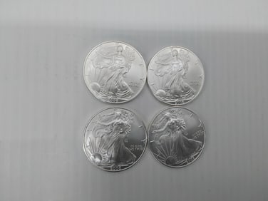 (4) 2006 silver Eagles