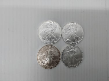 (4) 2006 silver Eagles