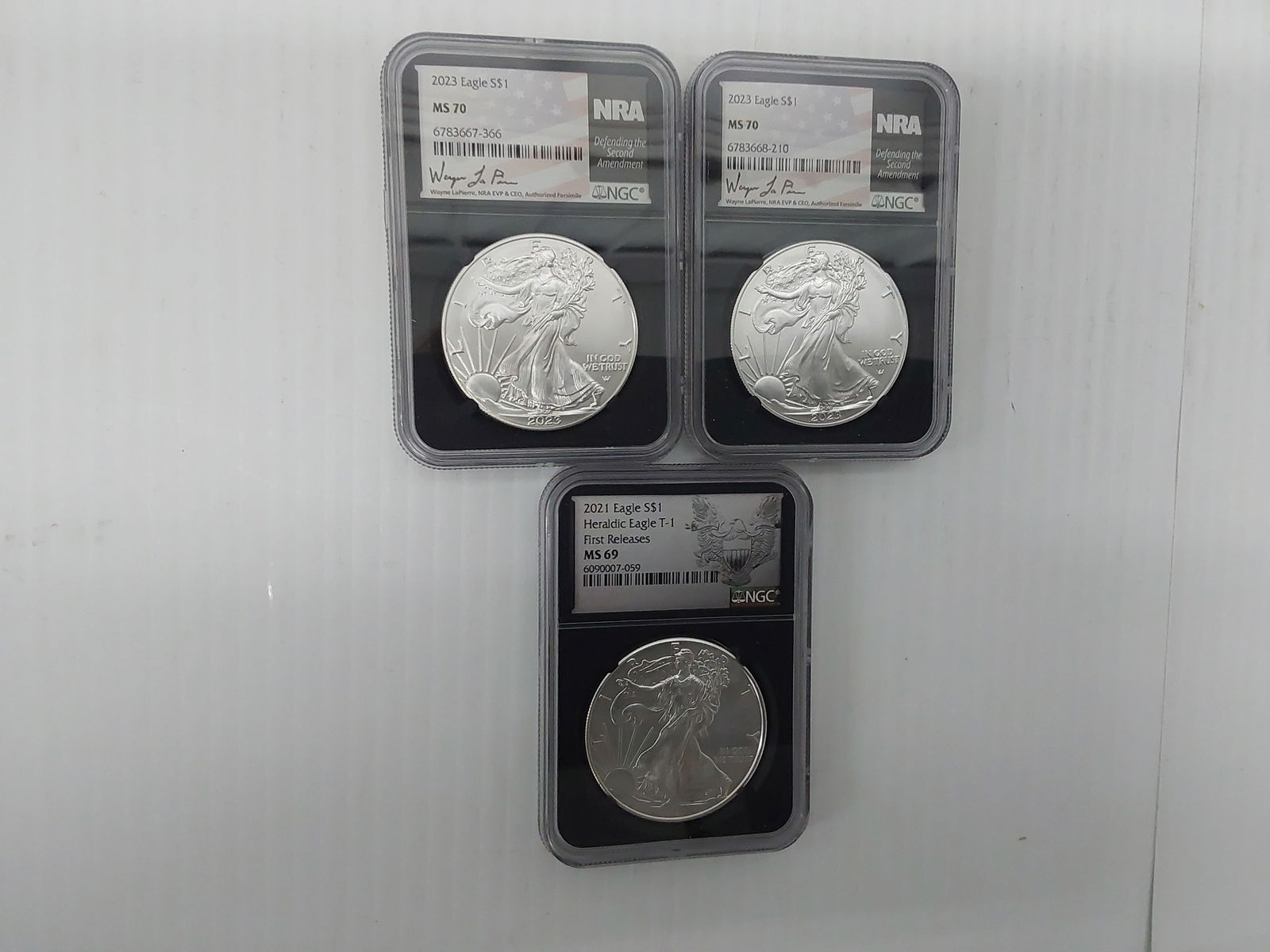 (3) graded and signed silver Eagles (1 of 1)