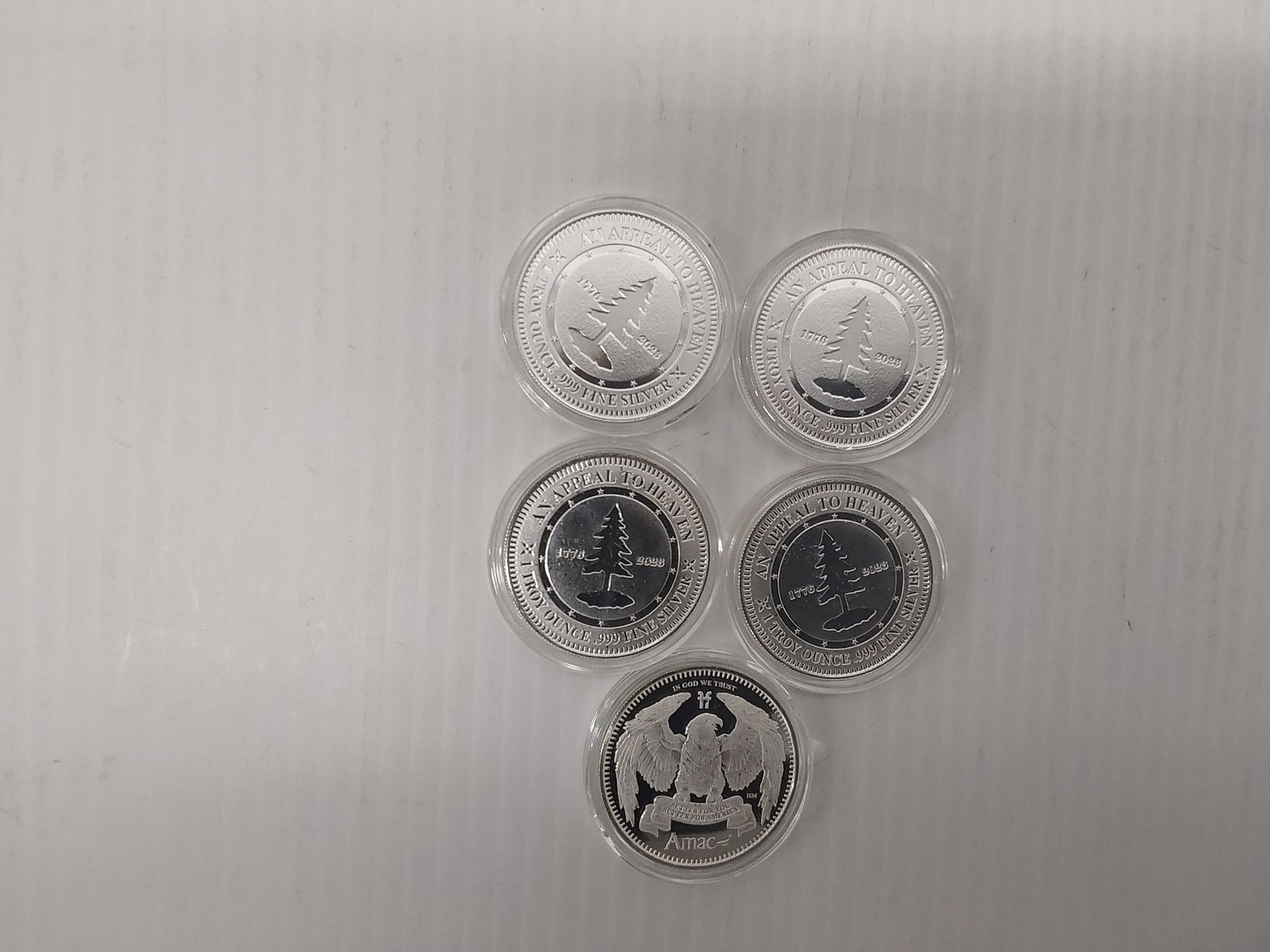 (5) 1 ozt silver rounds (AMAC) in plastic: (5) 1 ozt silver rounds (AMAC) in plastic